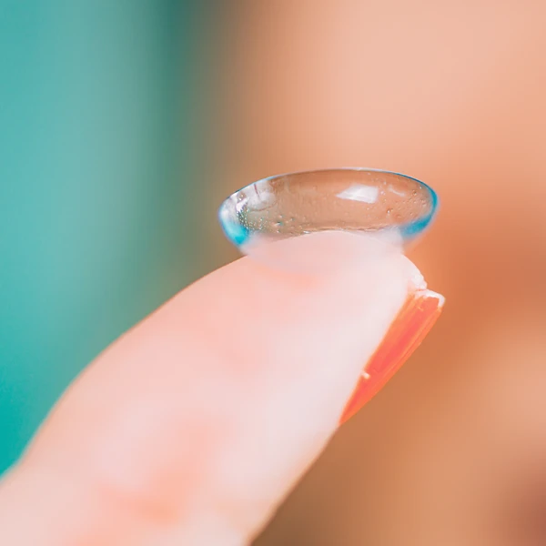 Closeup Of Contact Lens Resting On Fingertip