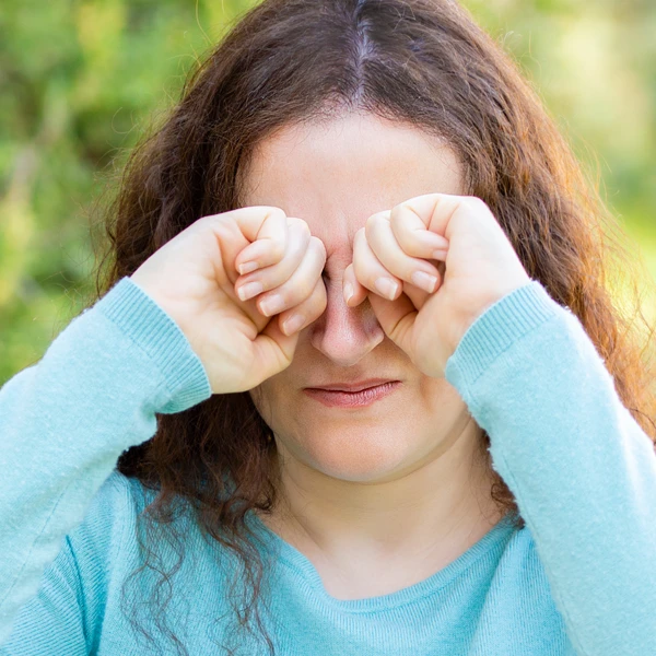 Person Rubbing Eyes Due To Eye Irritation