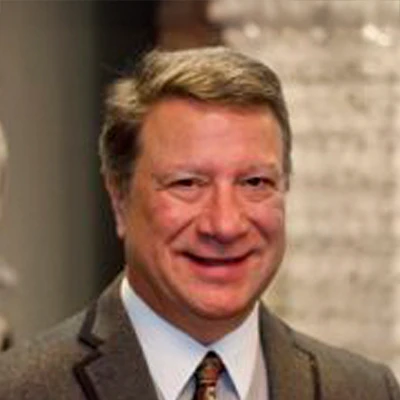 Professional Headshot Of Eye Care Team Member In Business Attire