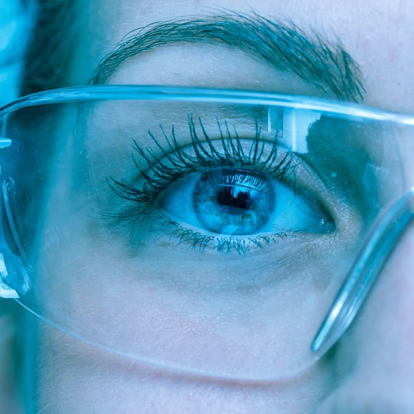 Closeup Of Eye Wearing Protective Safety Glasses