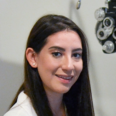 Professional Headshot Of Eye Care Team Member In Examination Room